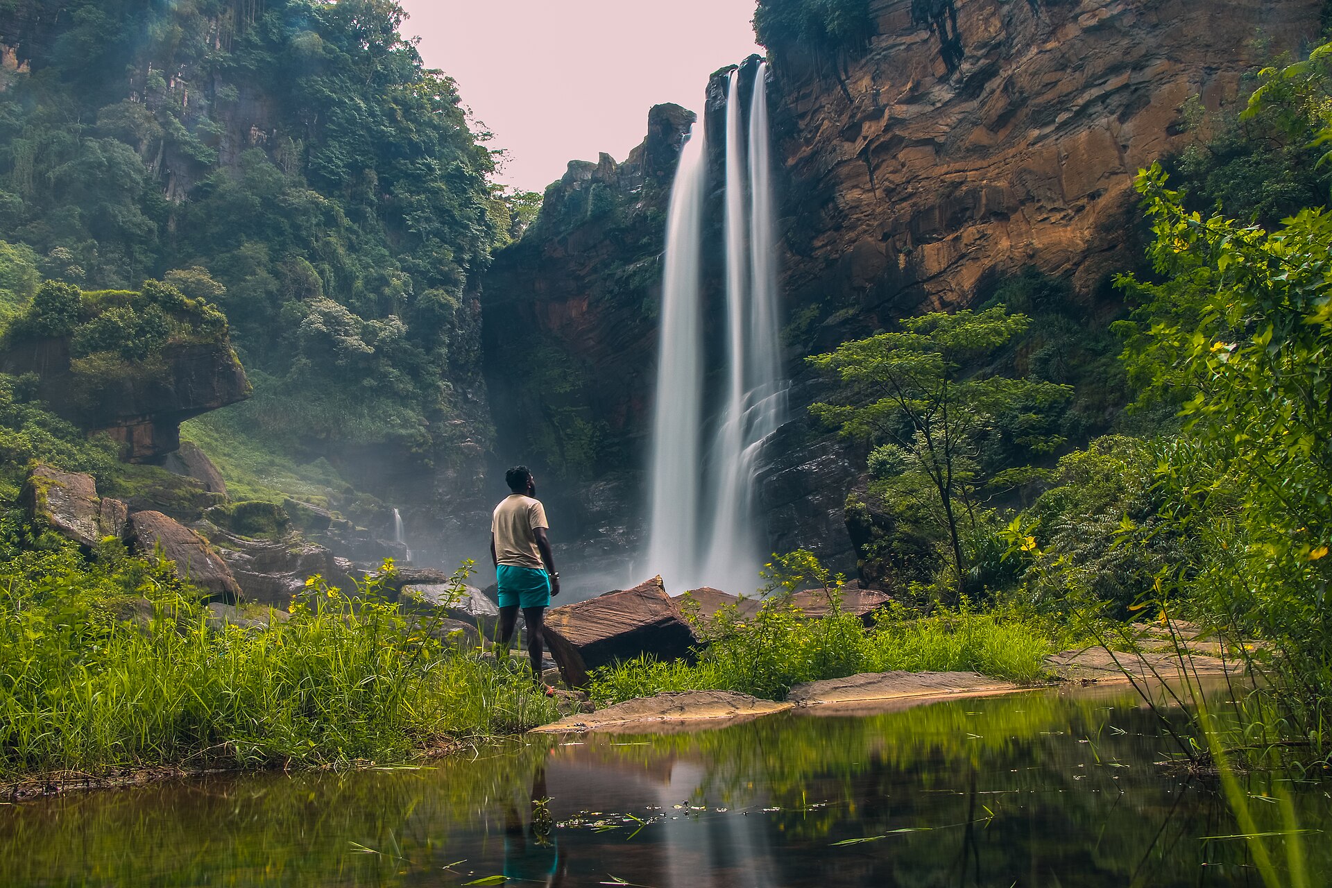Laxapana Falls dropping in twin columns through forested cliffs in the central highlands